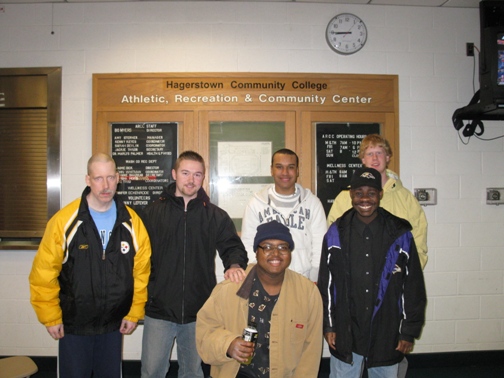 Potomac Center individuals attend a basketball game at Hagerstown Community College. In attendance, left to right, back row: Robert Brandt, Daniel Hutson- Recreational Therapist, Aaron Stoner - volunteer, Greg Lynn- volunteer, front row: Jamie Edwards, Monte Moss. Not pictured: Lisa Lynn- Volunteer Coordinator